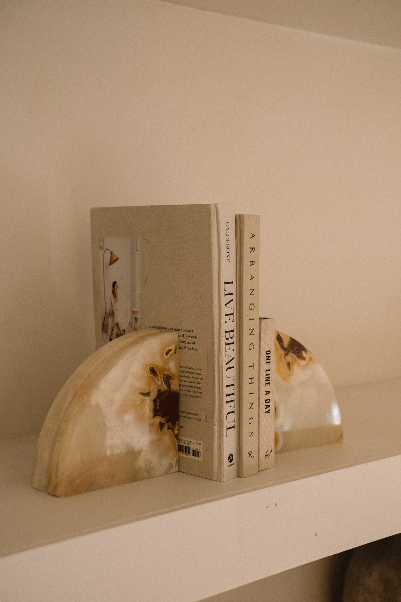 Interiors books styled on a shelf